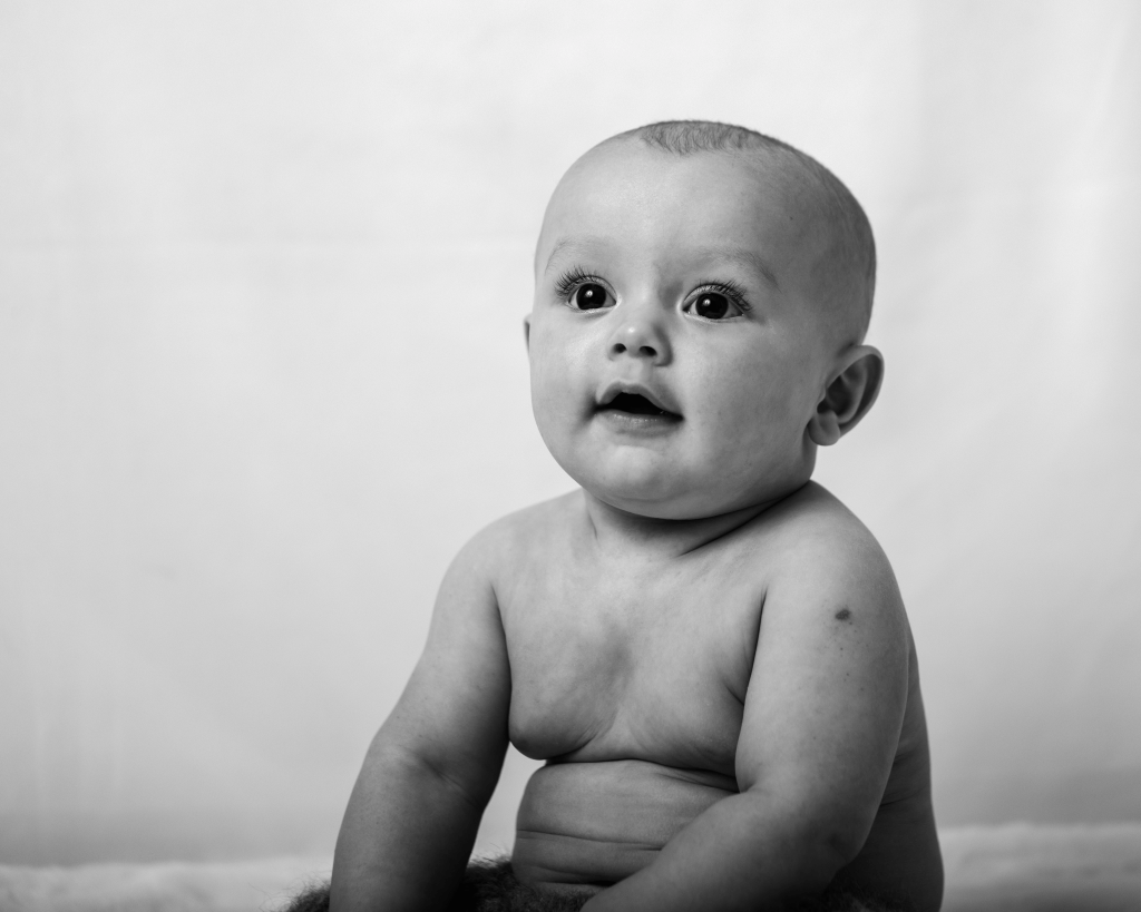 a little baby boy with wide eyes