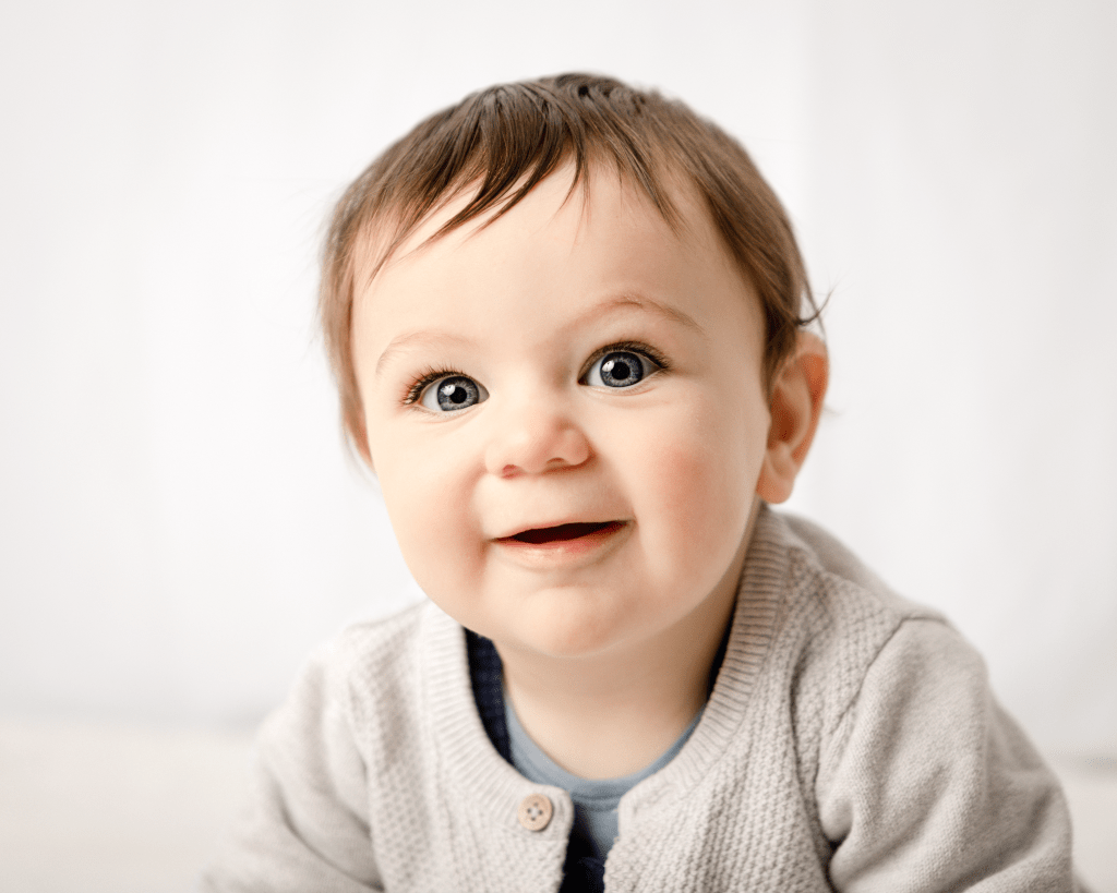 baby boy with huge open eyes looking lovingly in our direction